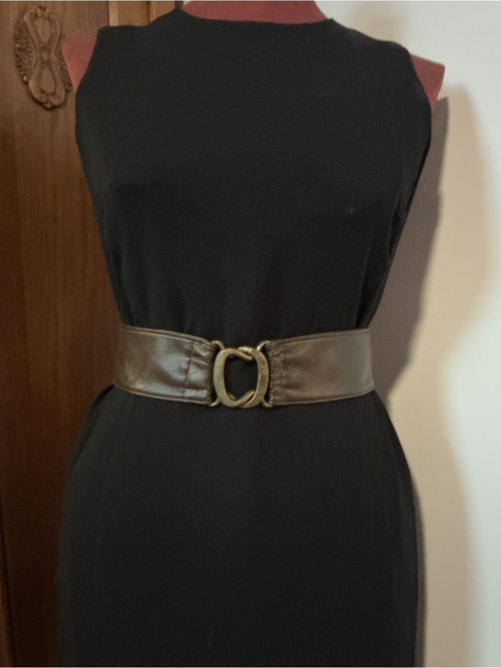 Dark brown leather equestrian-style belt with brass hoof-pick hardware